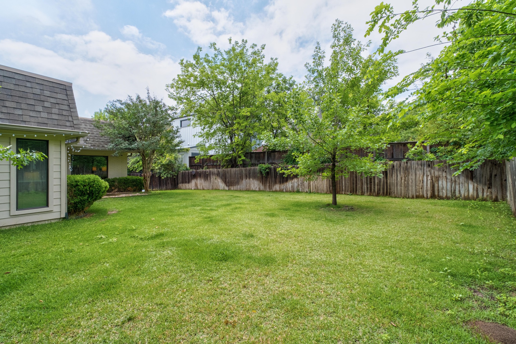 2802 Warren Street, Unit B Austin, TX 78703 - Photo 19 of 22 a view of a yard with a house