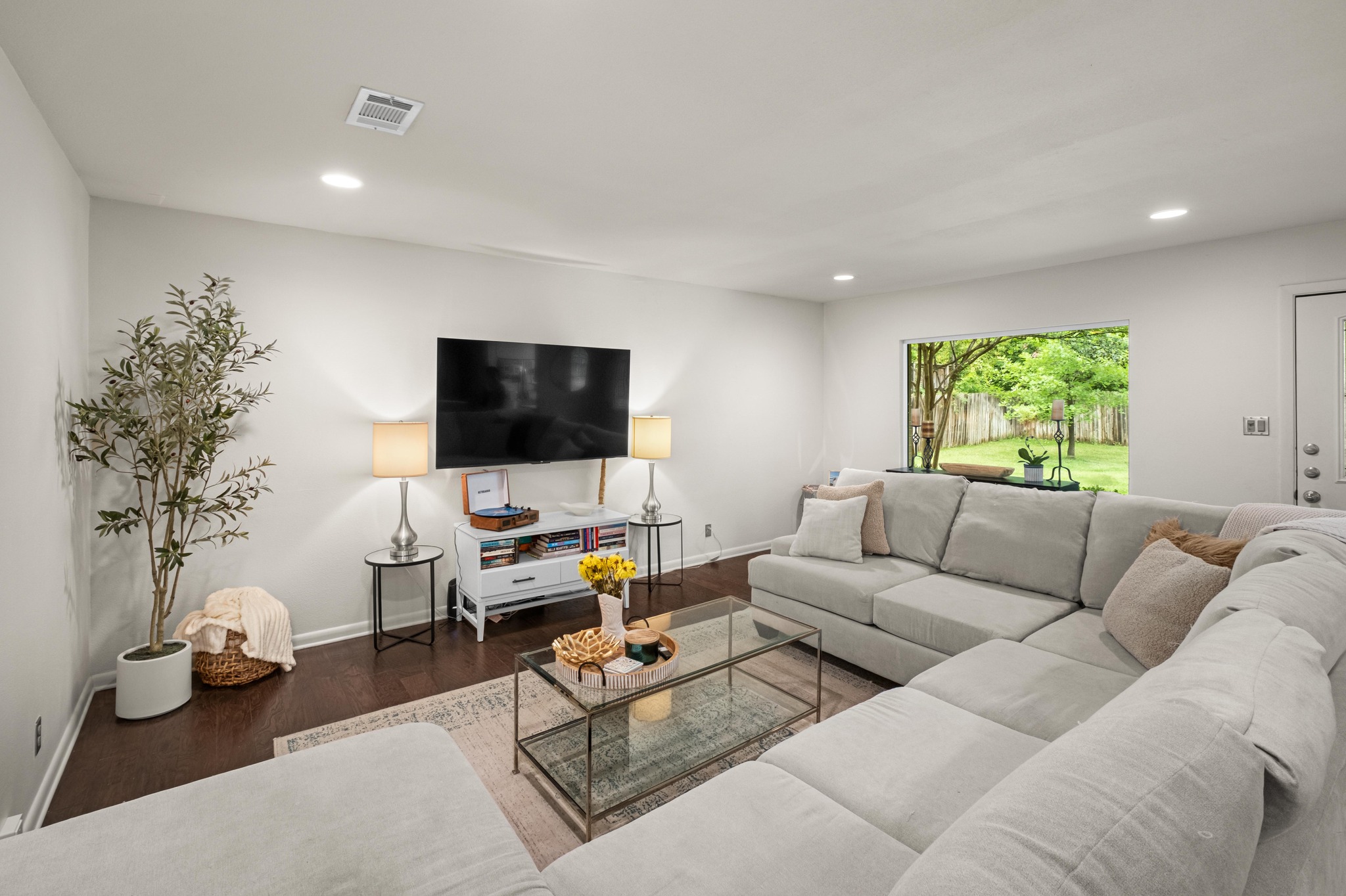 2802 Warren Street, Unit B Austin, TX 78703 - Photo 2 of 22 a living room with furniture and a flat screen tv