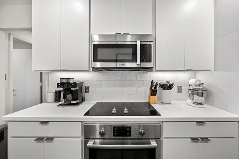 a kitchen with a stove and a microwave
