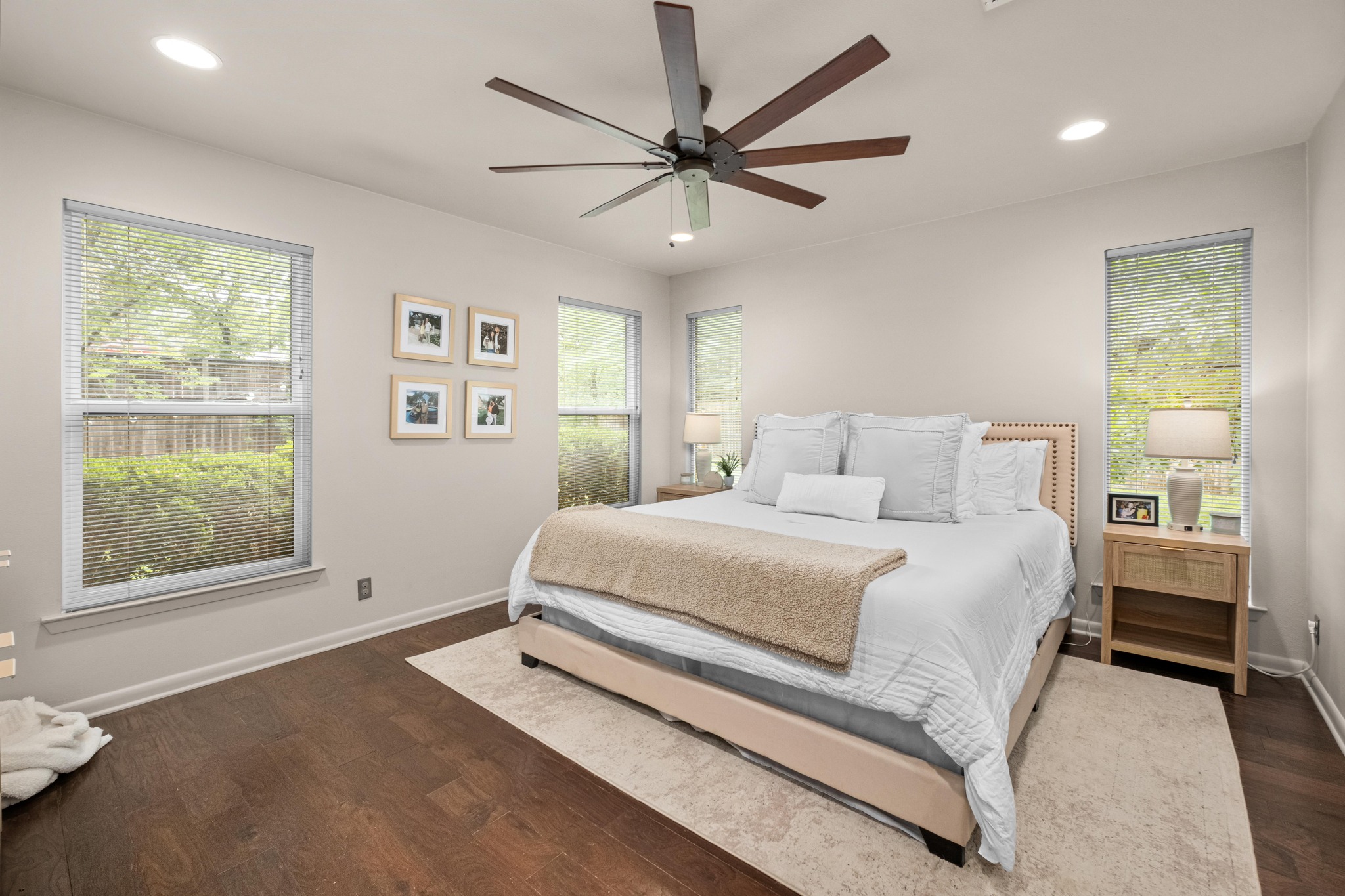 2802 Warren Street, Unit B Austin, TX 78703 - Photo 8 of 22 a spacious bedroom with a bed and a large window