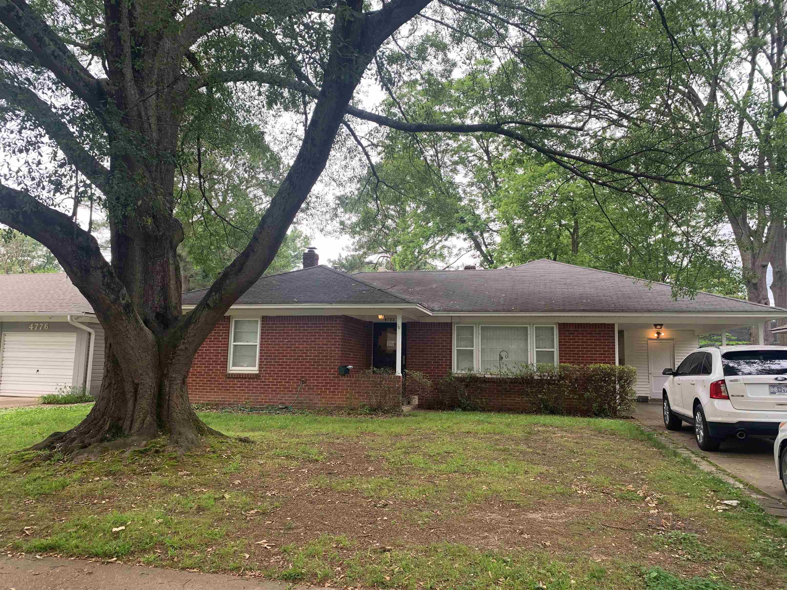 4782 Verne Road Memphis, TN 38117 - Photo 1 of 16 a front view of a house with garden