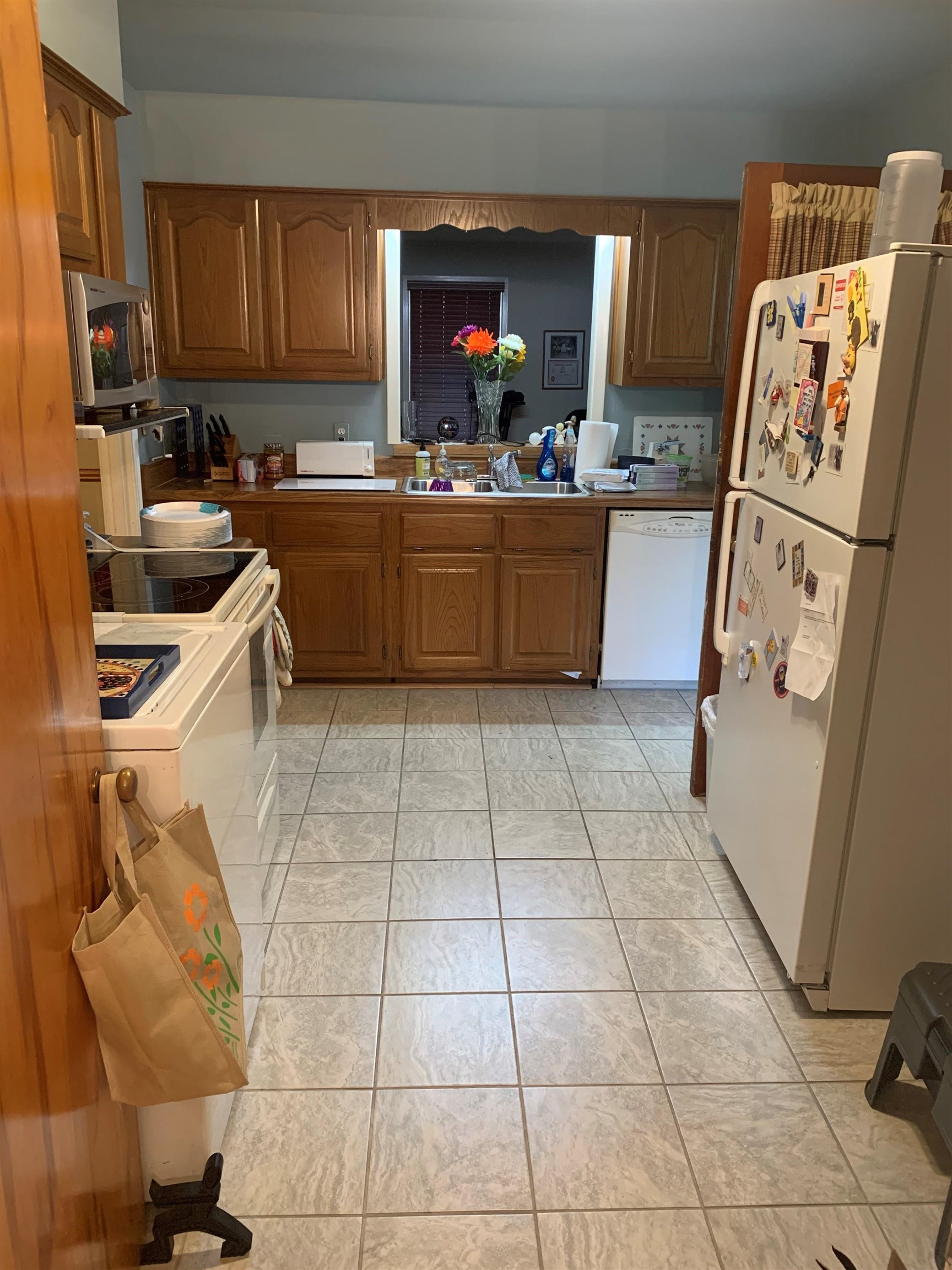 4782 Verne Road Memphis, TN 38117 - Photo 12 of 16 a kitchen with a sink a stove and a refrigerator