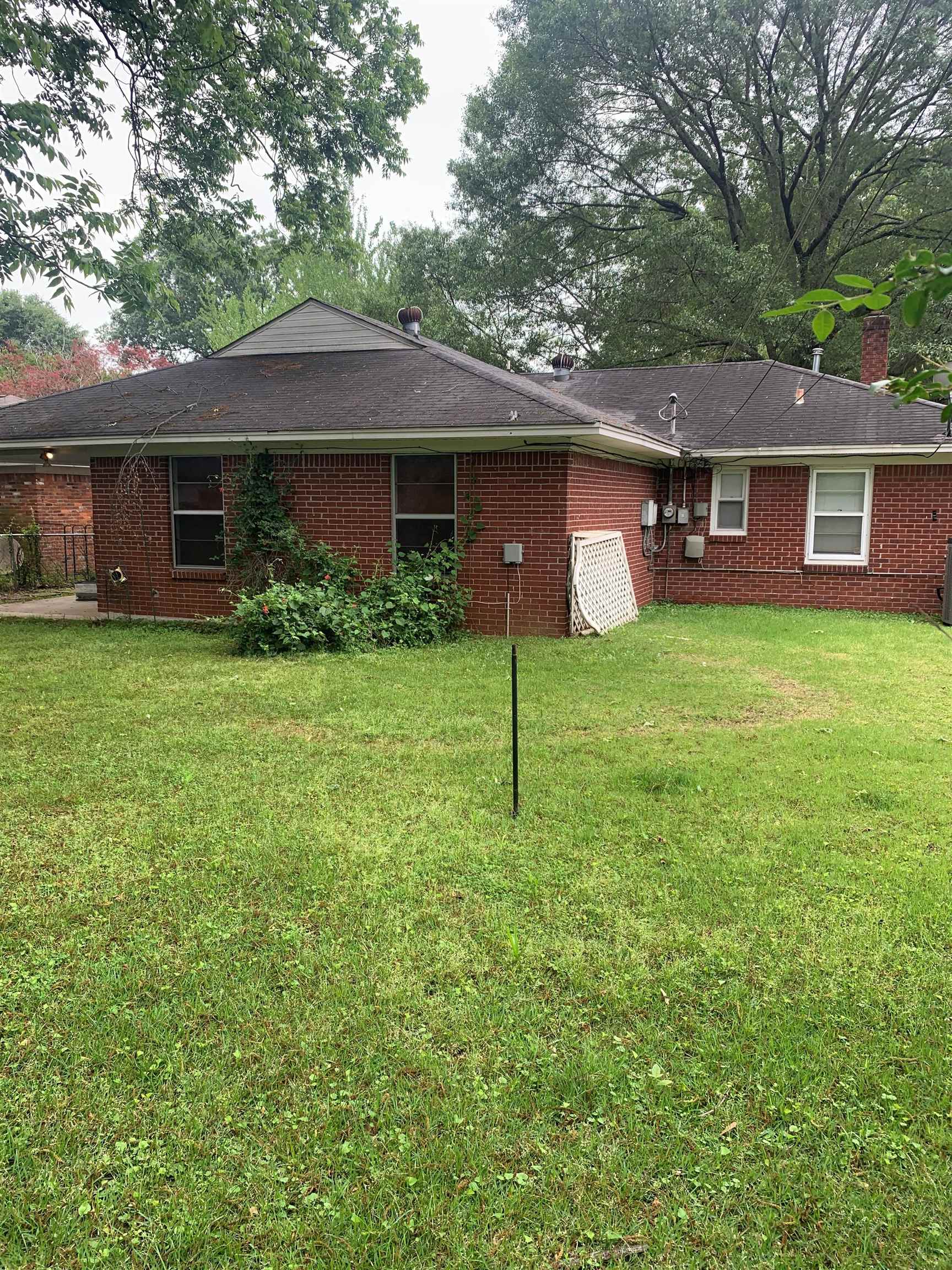 4782 Verne Road Memphis, TN 38117 - Photo 14 of 16 a front view of a house with garden