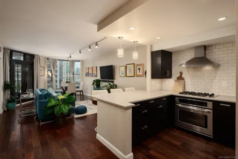a kitchen with a sink and stove top oven