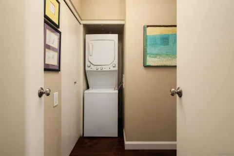 a living room with furniture a fireplace and a floor to ceiling window