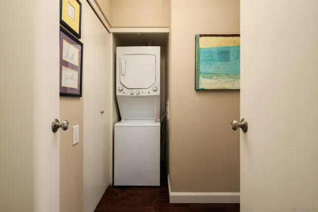 a living room with furniture a fireplace and a floor to ceiling window