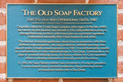 a living room with furniture and large windows