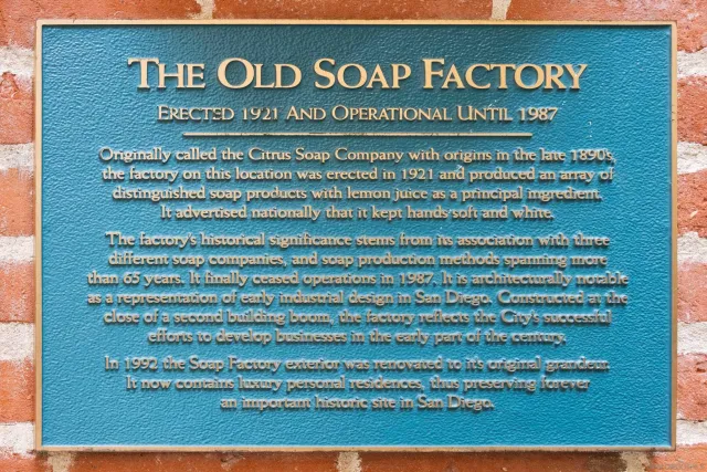 a living room with furniture and large windows