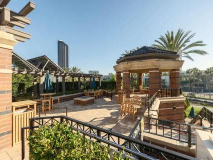 a view of a dinning table and chairs in patio