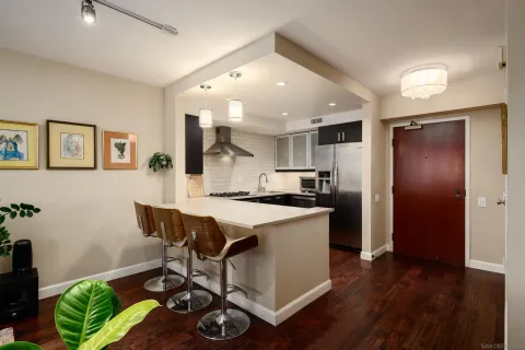a kitchen with a table and chairs in it