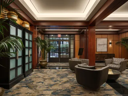 a view of a living room and kitchen with furniture