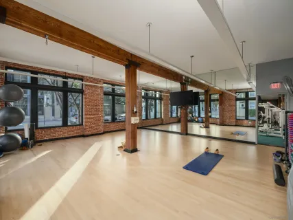 a view of a patio with couches and a fire pit