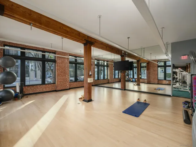 a view of a patio with couches and a fire pit