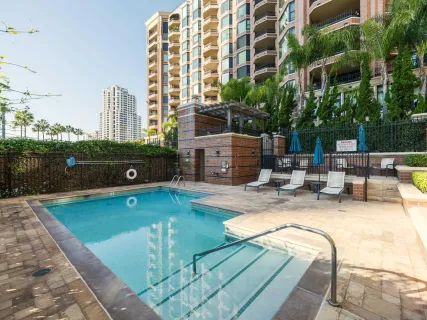 a view of a patio with couches and potted plants