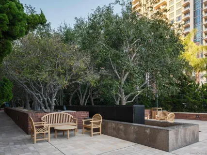 a view of a swimming pool with outdoor seating