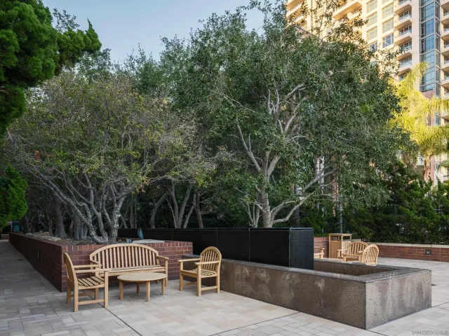 a view of a swimming pool with outdoor seating
