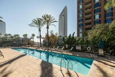 a view of swimming pool with outdoor seating and plants