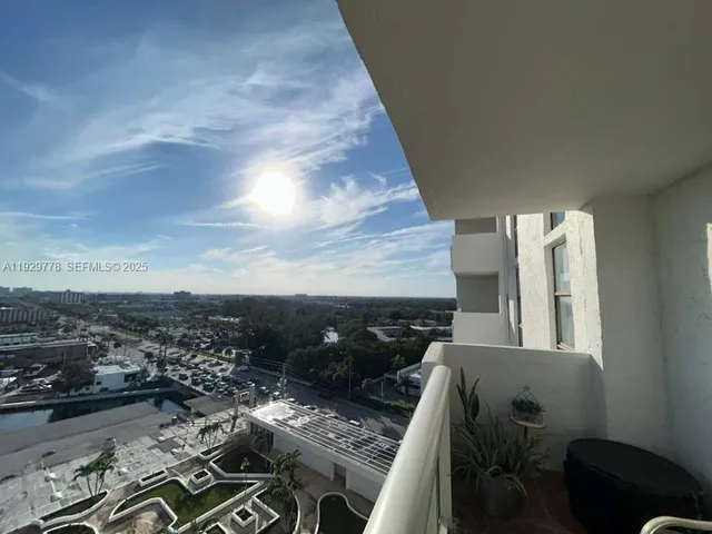 an aerial view of multiple houses with yard