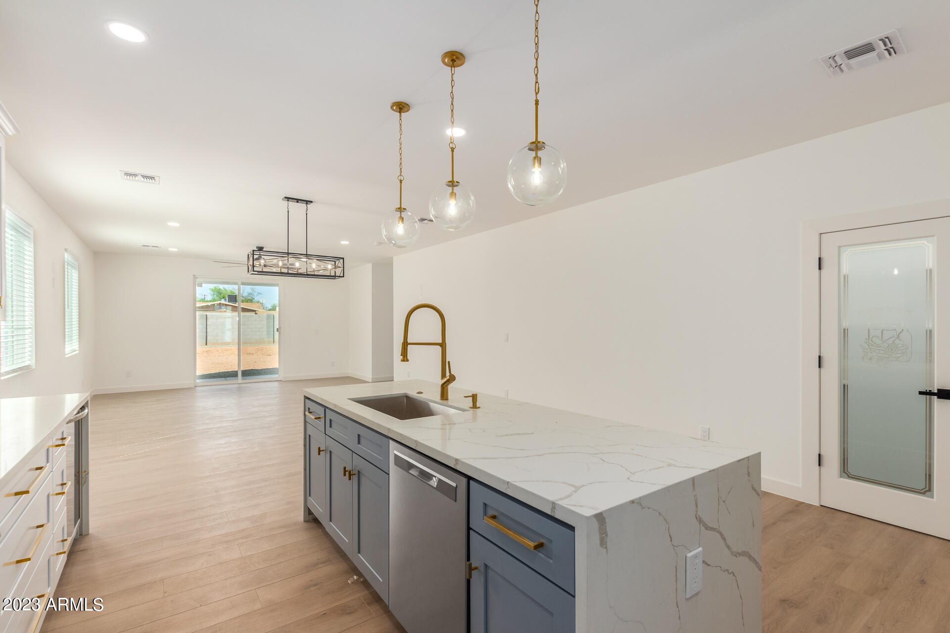 Undisclosed Address Phoenix, AZ 85014 - Photo 16 of 47 a kitchen with stainless steel appliances granite countertop a sink a stove and a wooden floor