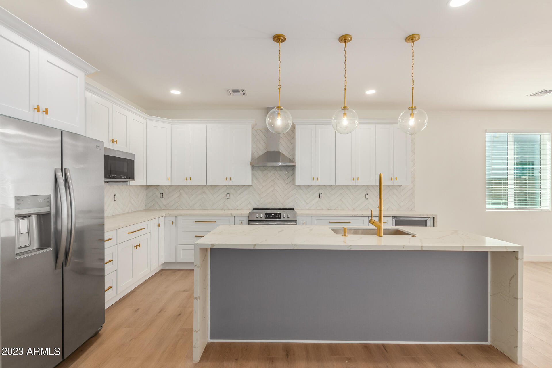 Undisclosed Address Phoenix, AZ 85014 - Photo 17 of 47 a large kitchen with kitchen island a sink stainless steel appliances and cabinets