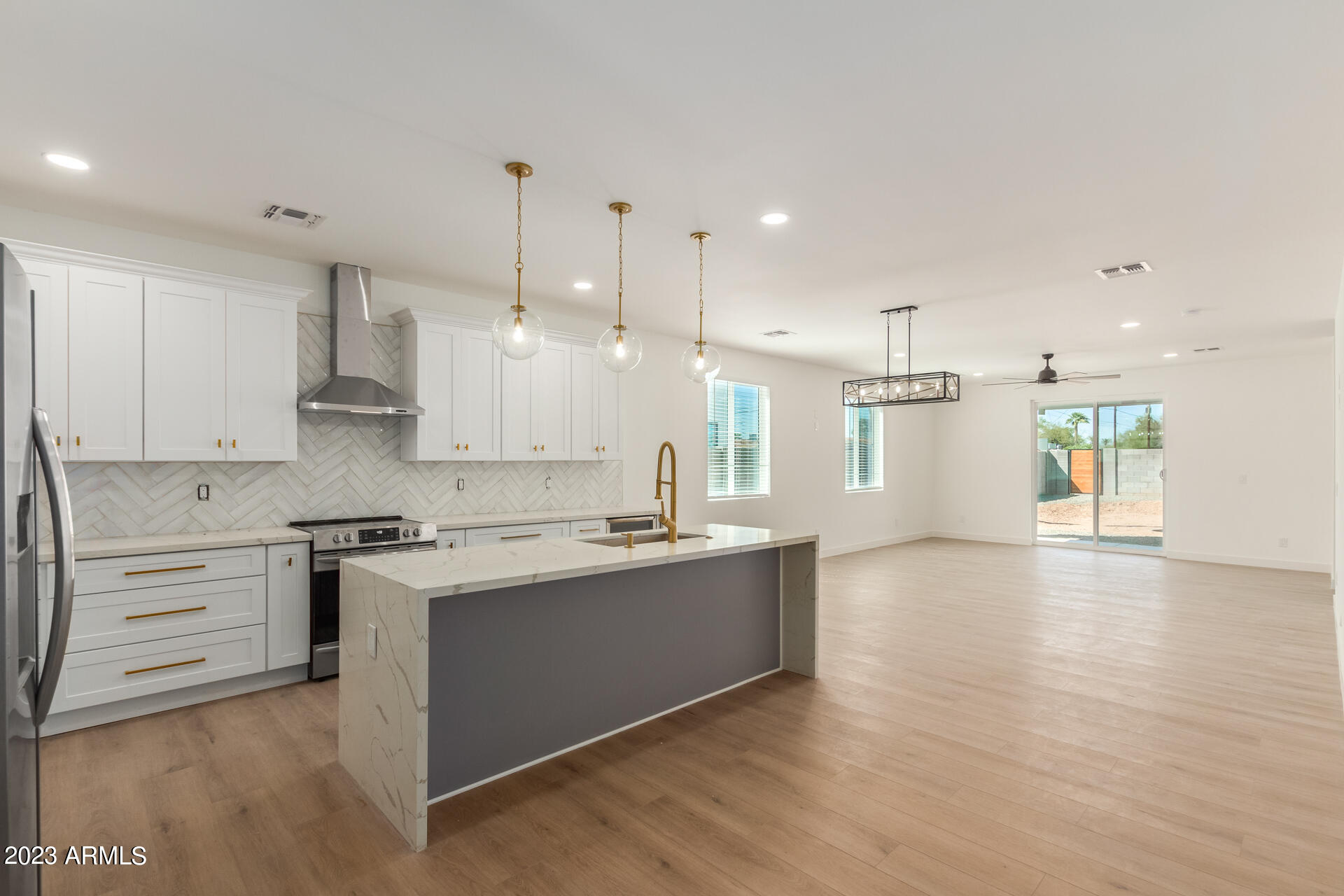 Undisclosed Address Phoenix, AZ 85014 - Photo 18 of 47 a kitchen with stainless steel appliances granite countertop a sink a stove and a refrigerator