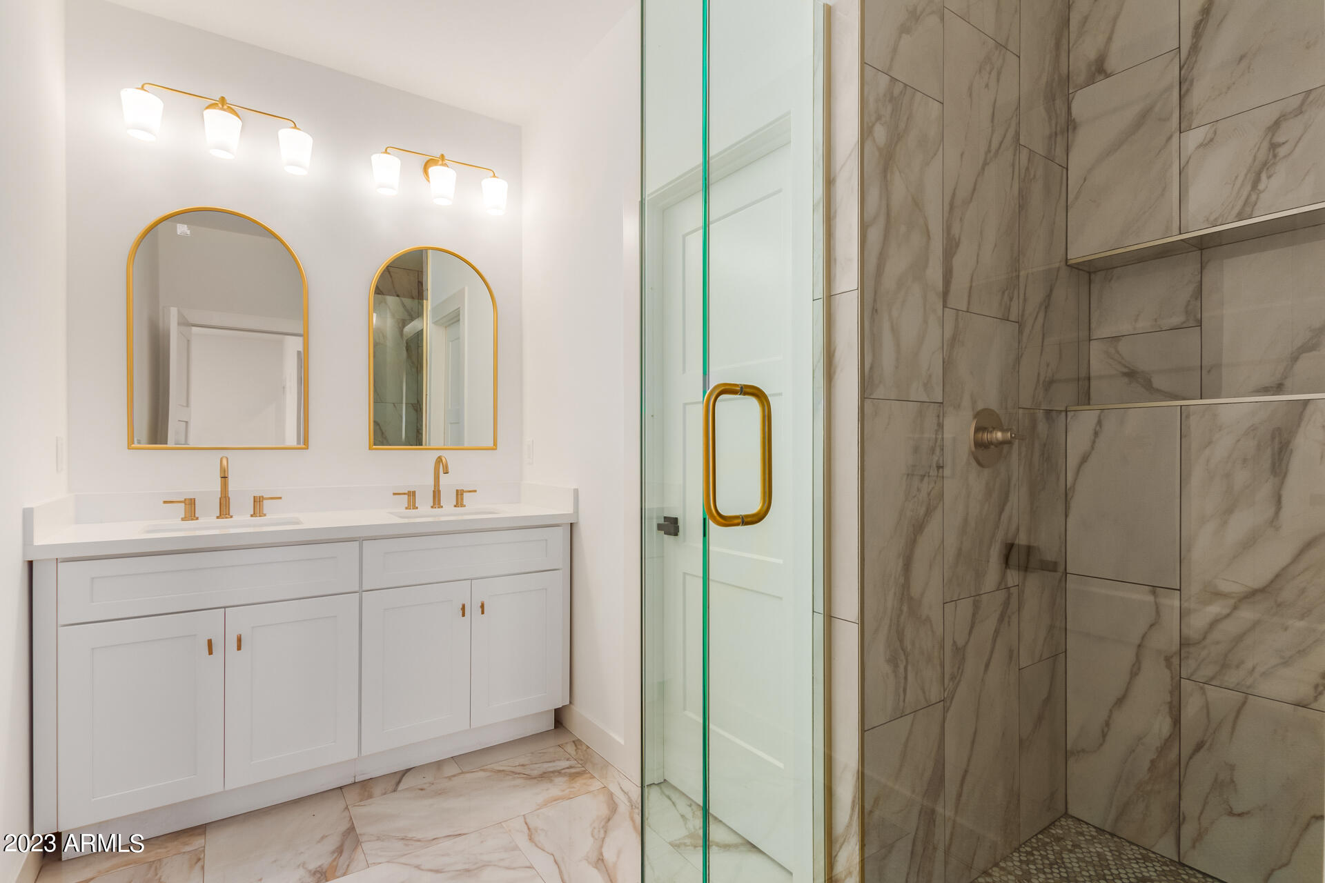 Undisclosed Address Phoenix, AZ 85014 - Photo 31 of 47 a bathroom with a double vanity sink and a mirror