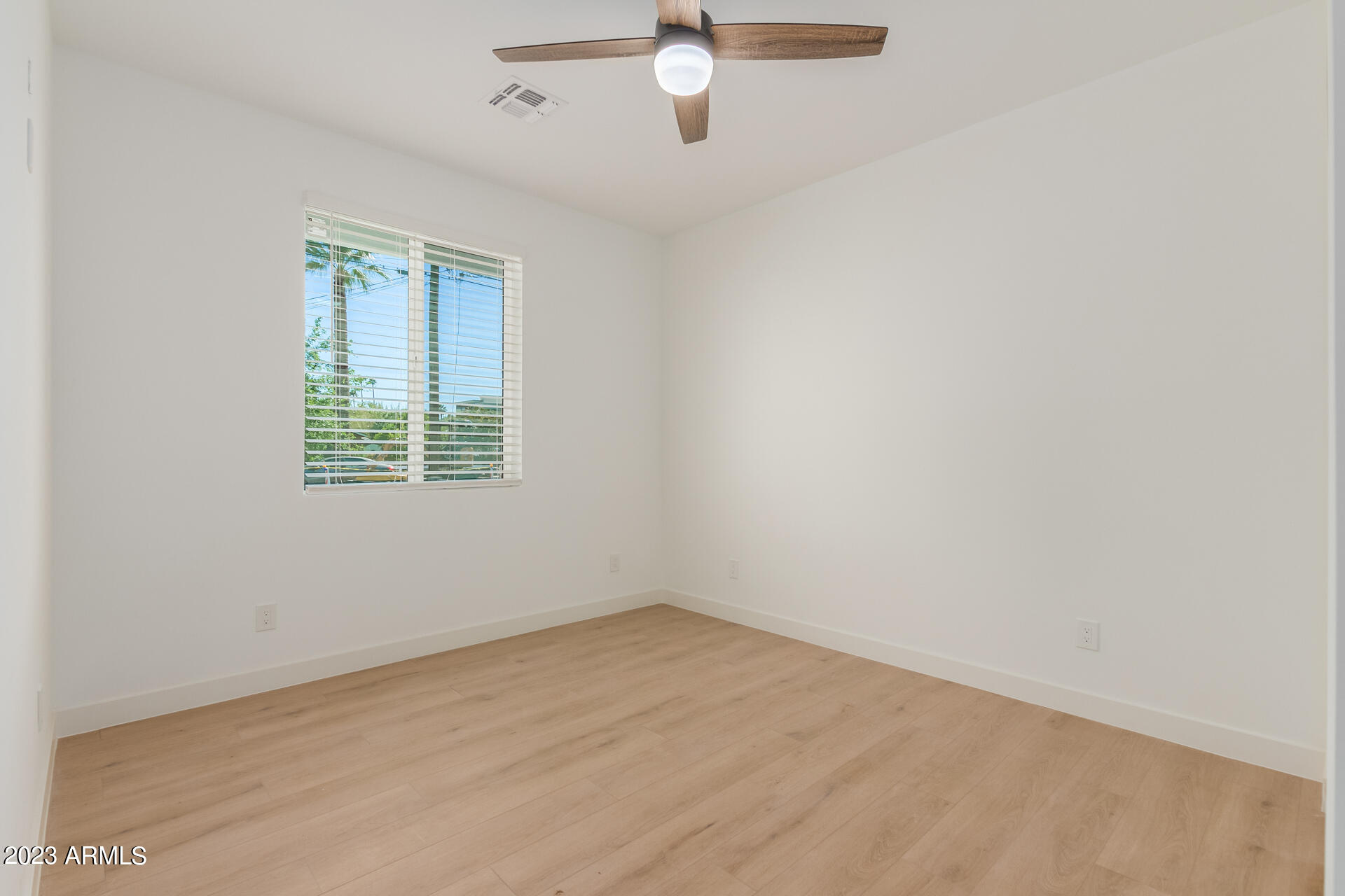 Undisclosed Address Phoenix, AZ 85014 - Photo 34 of 47 an empty room with a window