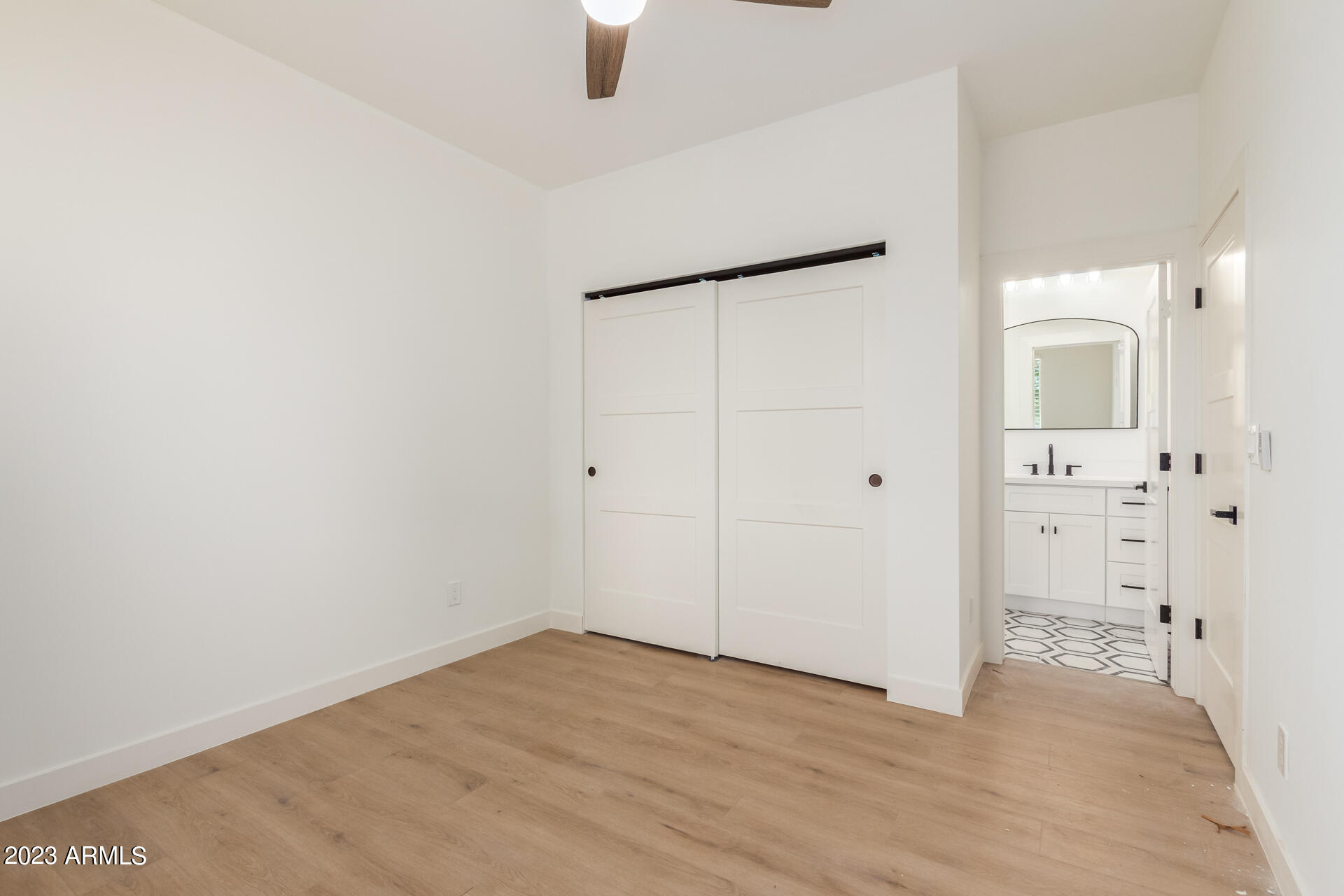 Undisclosed Address Phoenix, AZ 85014 - Photo 35 of 47 a view of an empty room with wooden floor