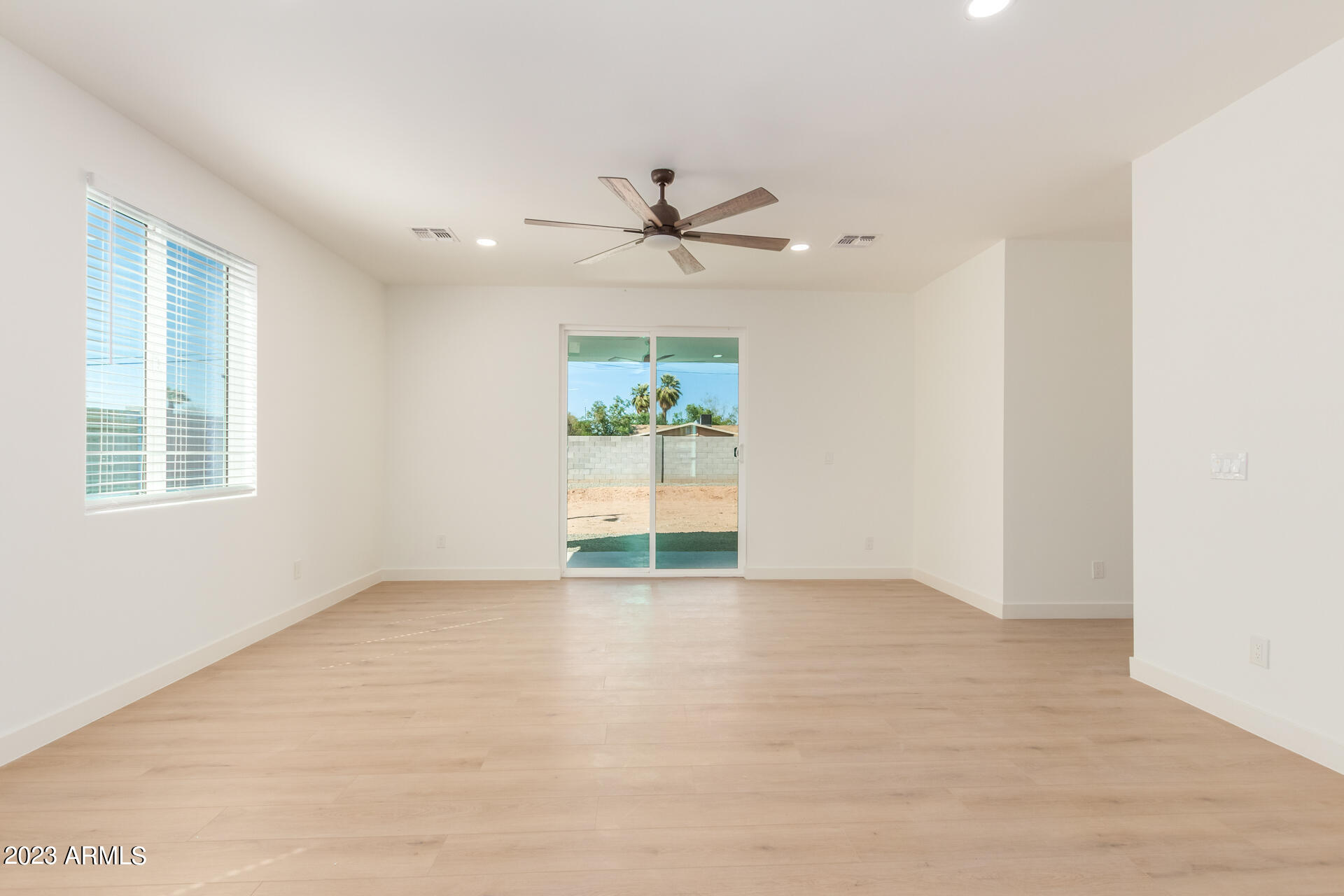 Undisclosed Address Phoenix, AZ 85014 - Photo 7 of 47 wooden floor in an empty room with a window