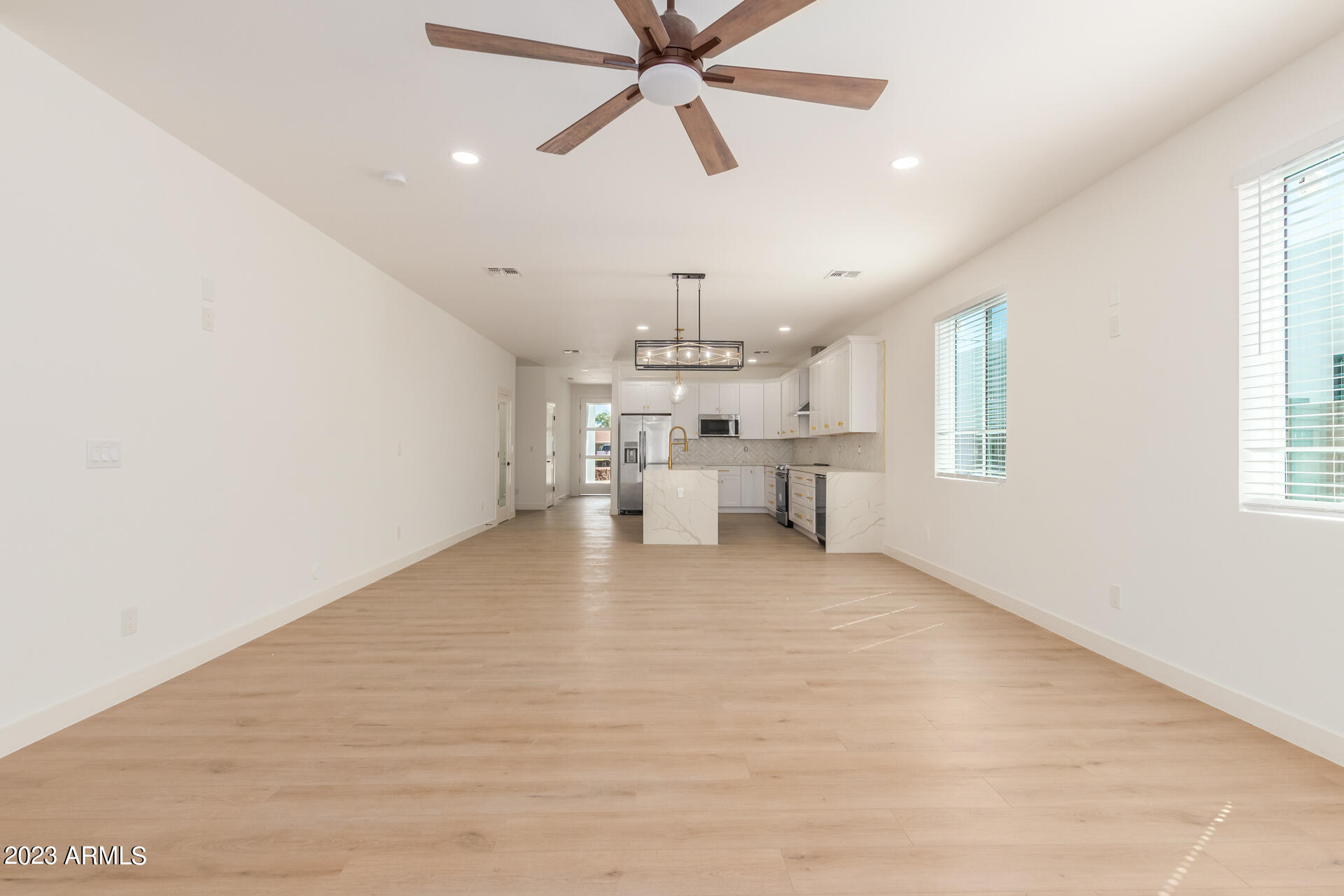 Undisclosed Address Phoenix, AZ 85014 - Photo 8 of 47 a view of a livingroom with a ceiling fan and window