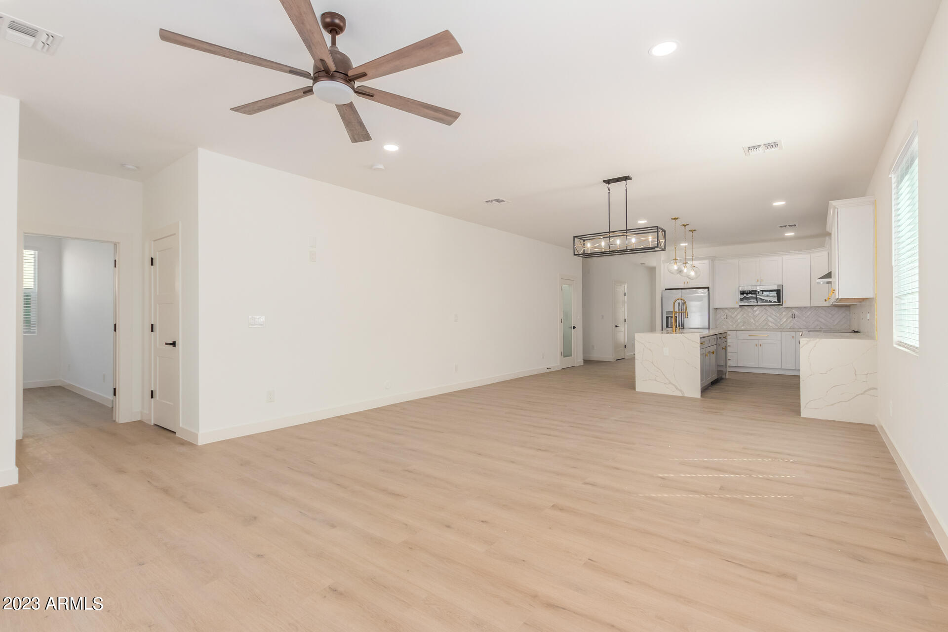 Undisclosed Address Phoenix, AZ 85014 - Photo 9 of 47 a view of a kitchen with a sink and a refrigerator