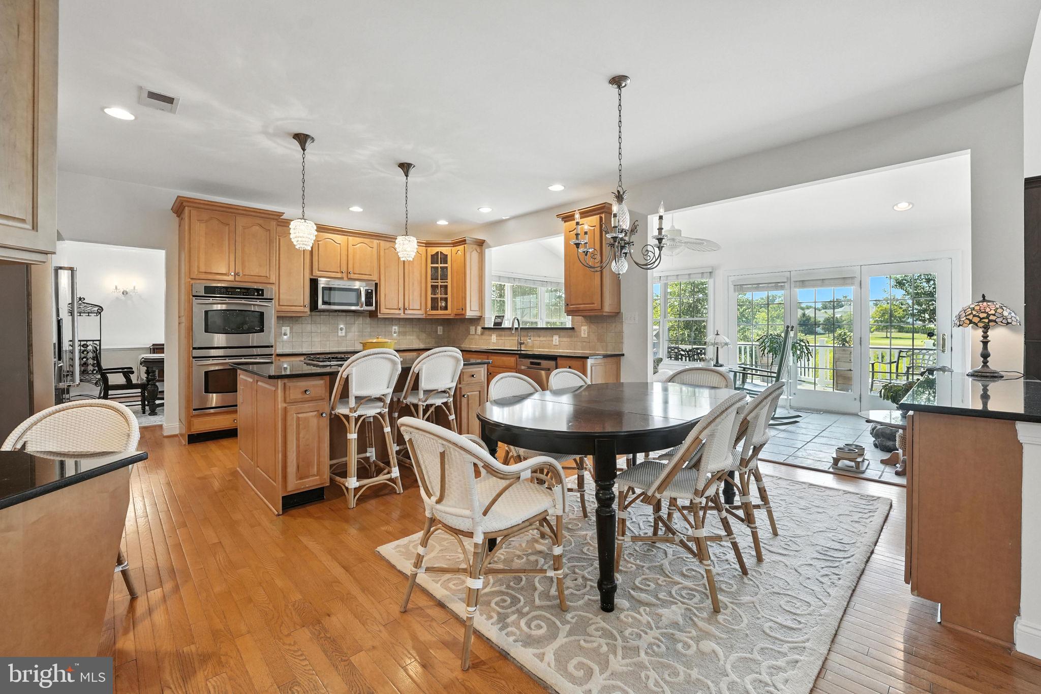 43152 Valiant Drive Chantilly, VA 20152 - Photo 12 of 44 a view of a dining room with furniture window and wooden floor