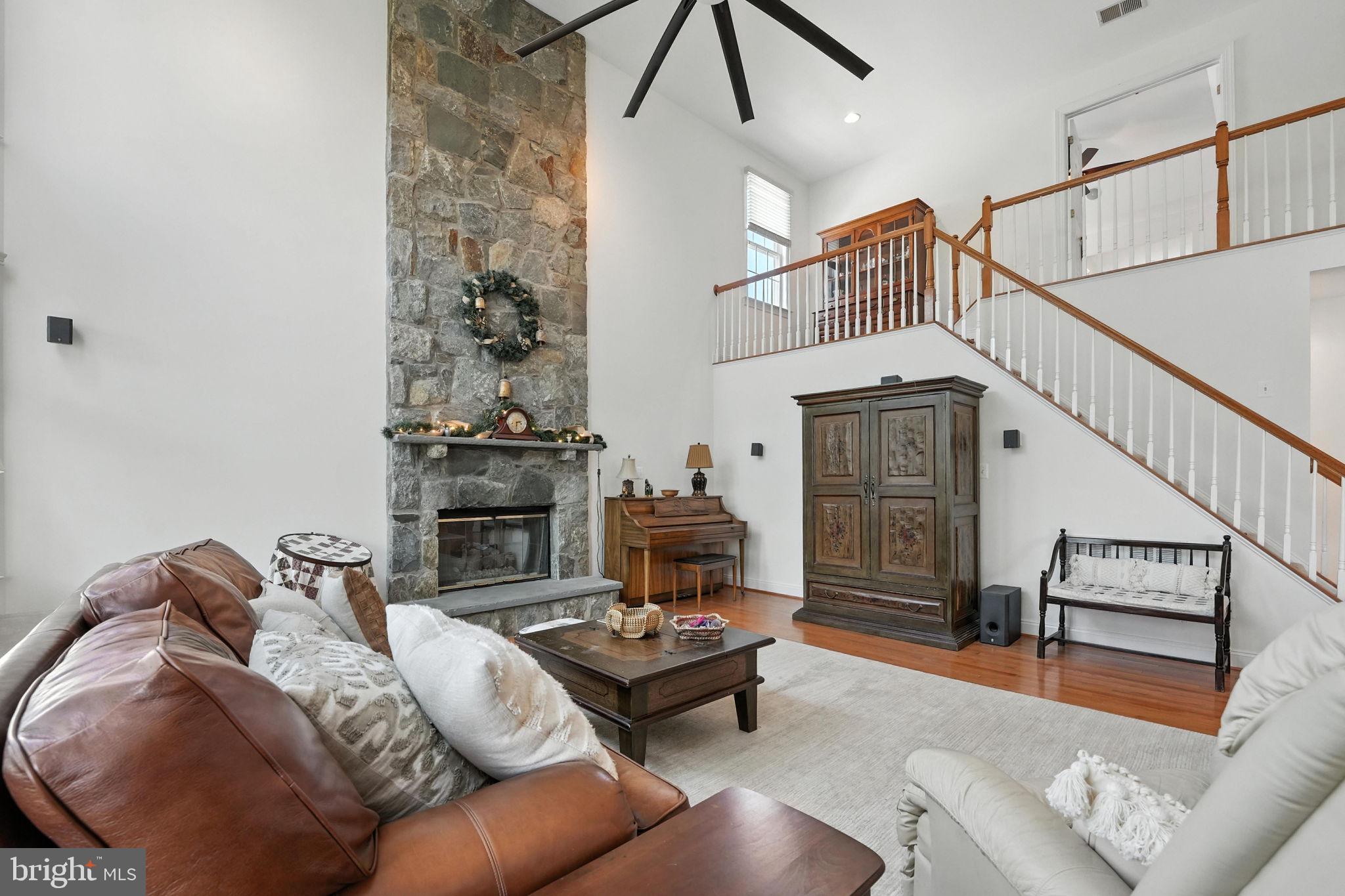 43152 Valiant Drive Chantilly, VA 20152 - Photo 14 of 44 a living room with furniture and a fireplace