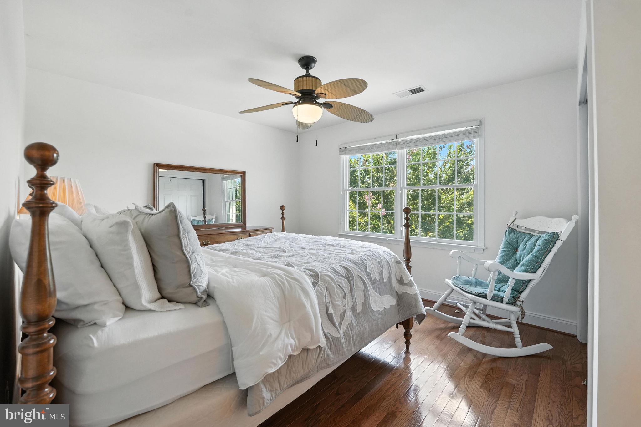 43152 Valiant Drive Chantilly, VA 20152 - Photo 20 of 44 a bedroom with a bed and wooden floor