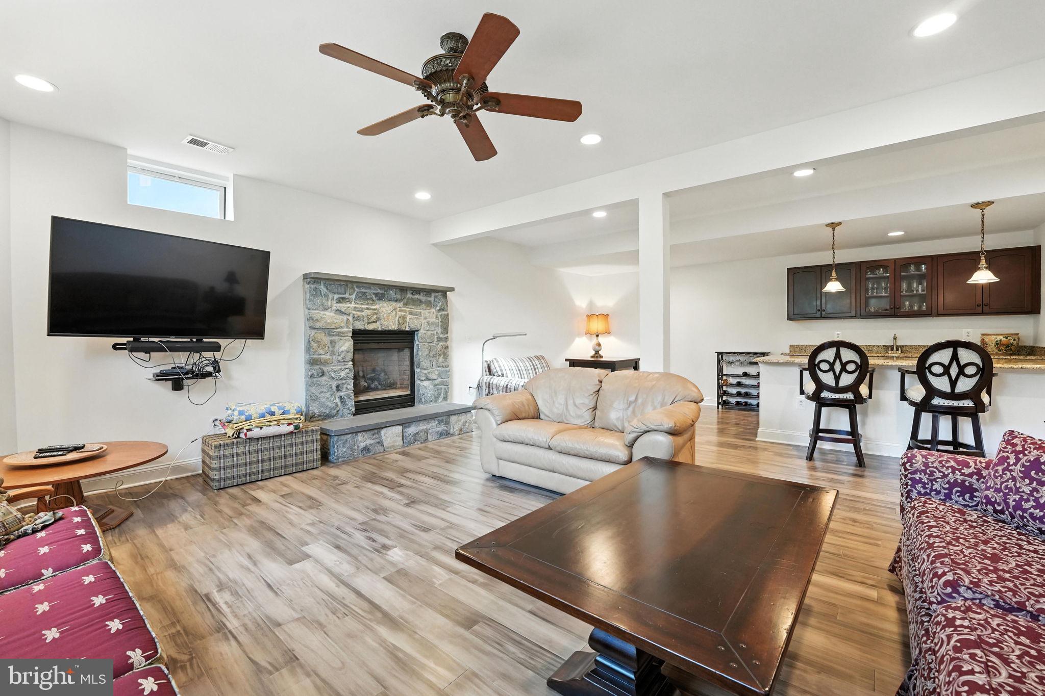 43152 Valiant Drive Chantilly, VA 20152 - Photo 26 of 44 a living room with furniture and a flat screen tv