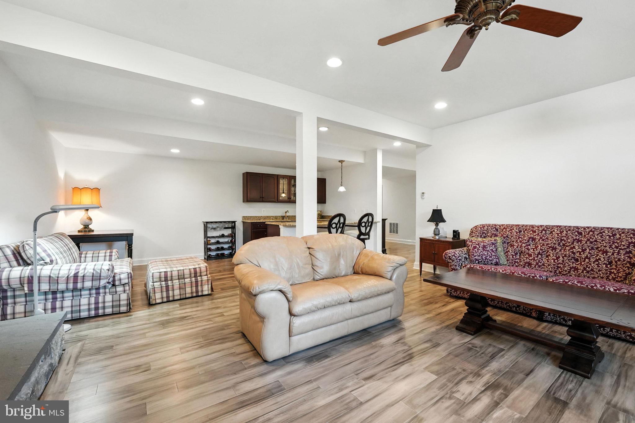 43152 Valiant Drive Chantilly, VA 20152 - Photo 27 of 44 a living room with furniture and a wooden floor
