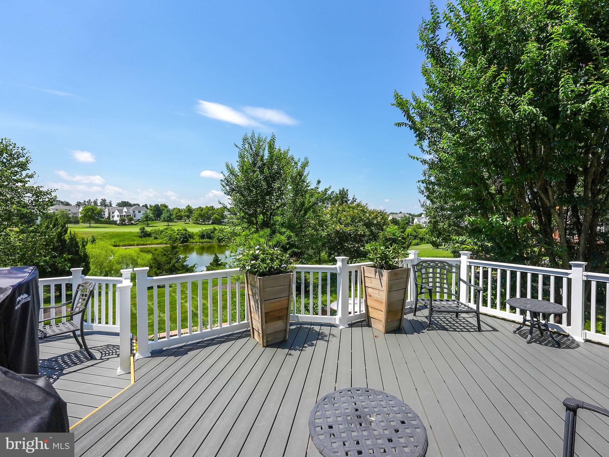 43152 Valiant Drive Chantilly, VA 20152 - Photo 36 of 44 a view of a wooden deck with a patio
