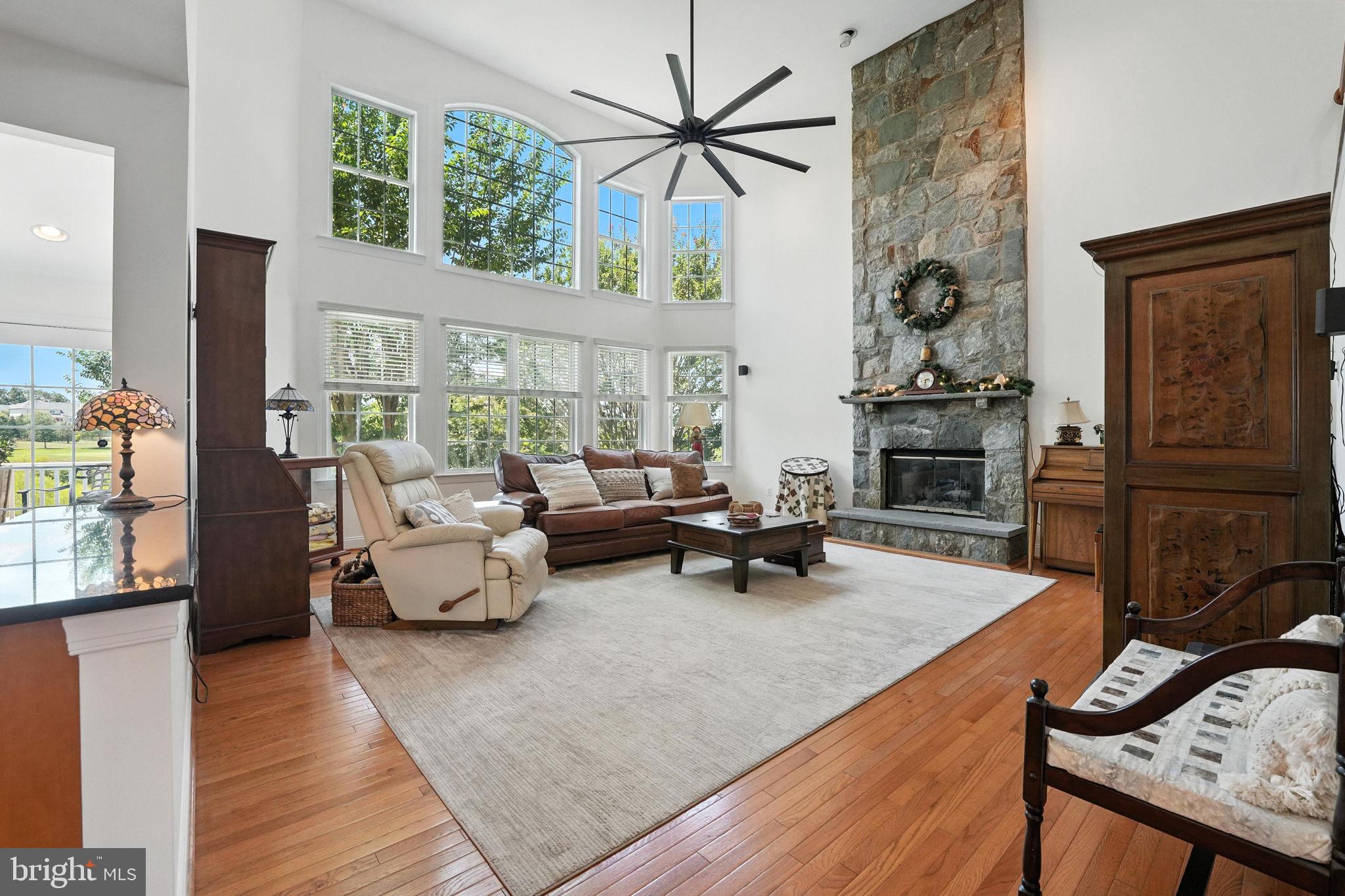 43152 Valiant Drive Chantilly, VA 20152 - Photo 4 of 44 a living room with furniture and a fireplace