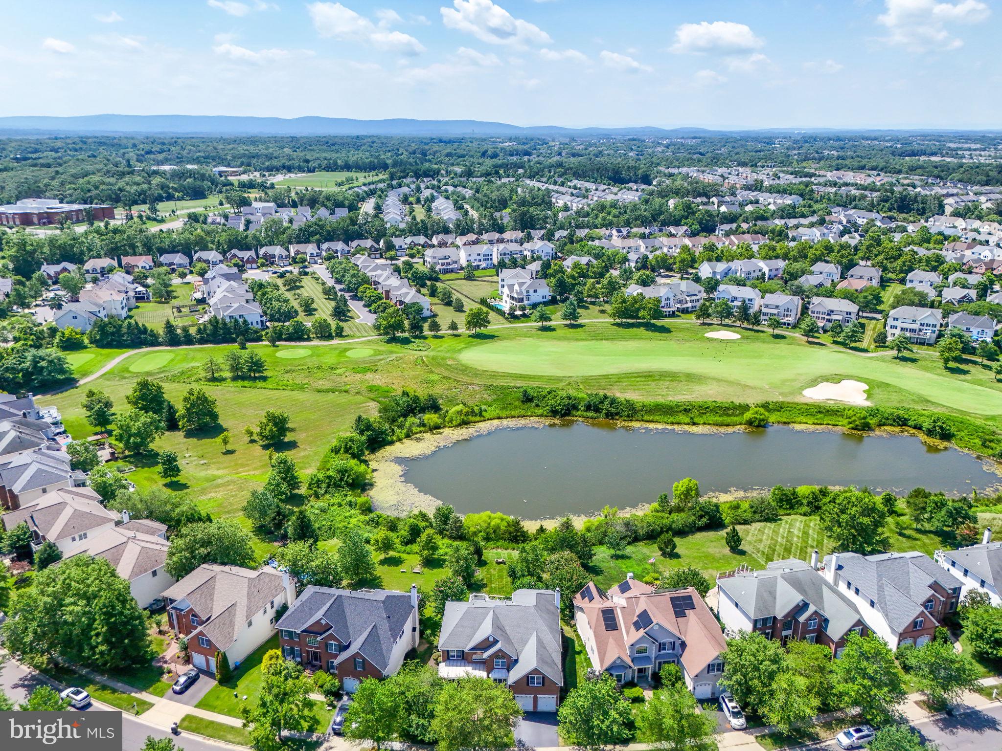 43152 Valiant Drive Chantilly, VA 20152 - Photo 43 of 44 an aerial view of a house with a garden and lake view