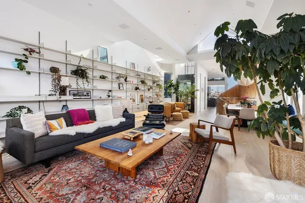 a living room with furniture and a rug
