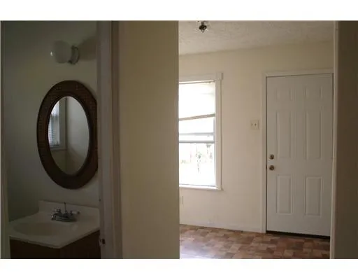 a view of a livingroom with a washer and dryer