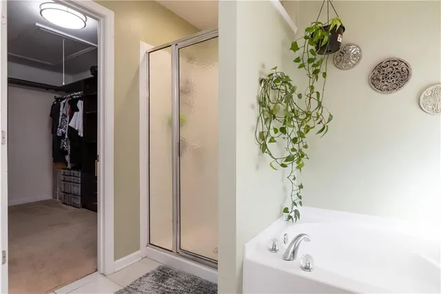 a bath room with a bathtub and a shower