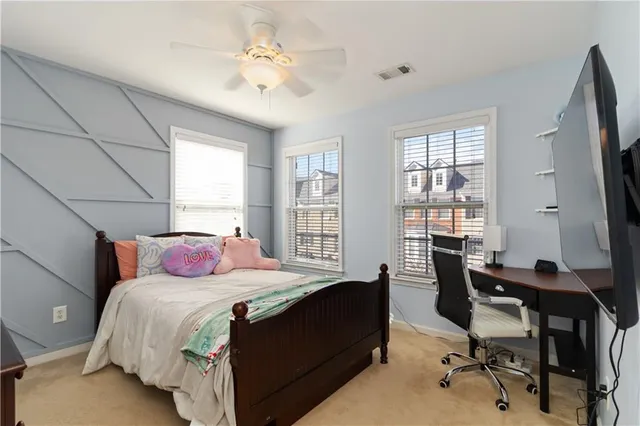 a bedroom with a bed and a table