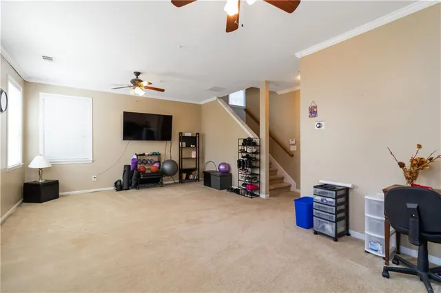 a view of a livingroom with furniture and a flat screen tv