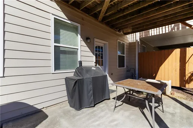 a view of a chairs and table in a patio