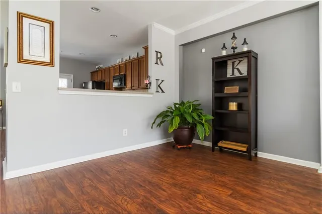 a view of an entryway with wooden floor