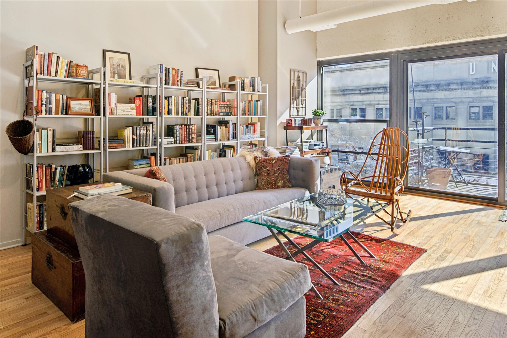 130 South Canal Street, Unit 323 Chicago, IL 60606 - Photo 12 of 26 a living room with furniture and a book shelf