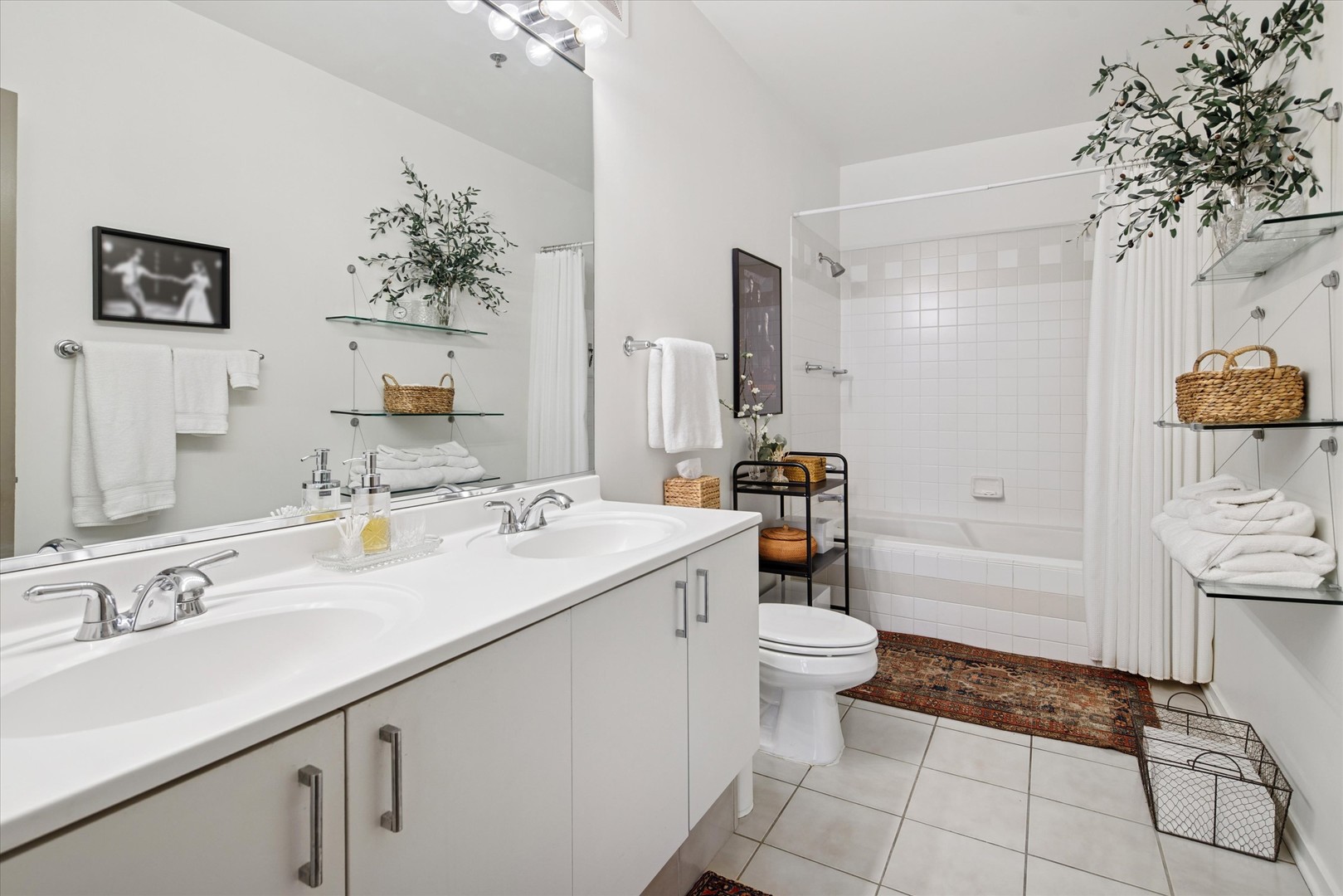 130 South Canal Street, Unit 323 Chicago, IL 60606 - Photo 16 of 26 a bathroom with a sink a toilet and shower