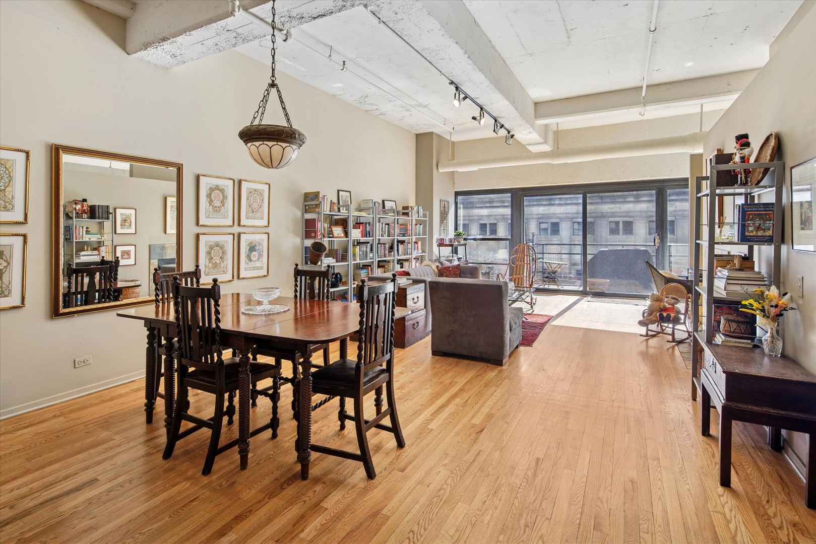 130 South Canal Street, Unit 323 Chicago, IL 60606 - Photo 5 of 26 a view of a dining room with furniture window and wooden floor