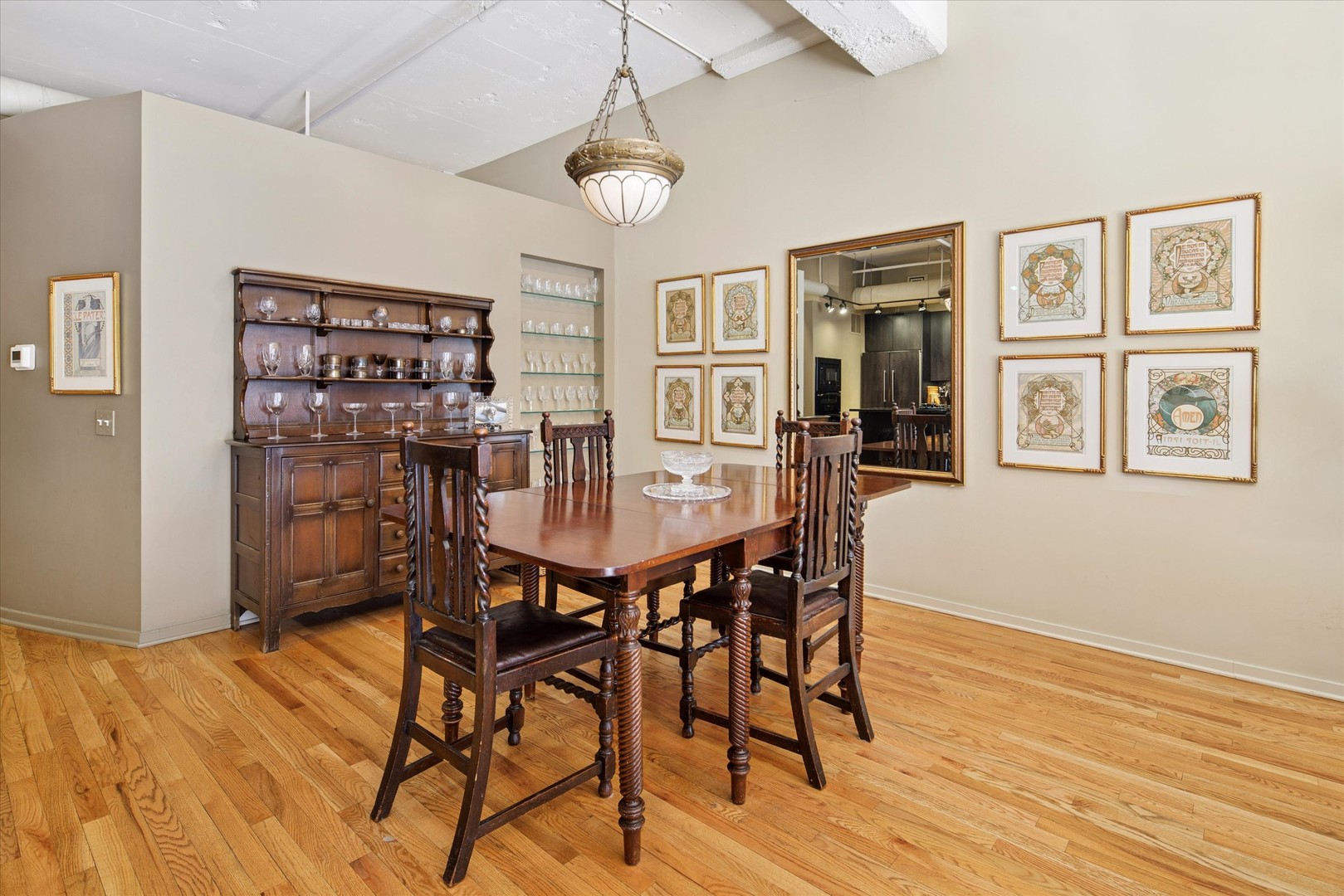 130 South Canal Street, Unit 323 Chicago, IL 60606 - Photo 7 of 26 a view of a dining room with furniture and wooden floor